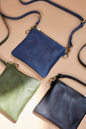 Best Small Black Bag? I'm looking for an everyday, black leather crossbody  bag. I have it narrowed down to these two. Does anyone have experience with  either of these brands (Cuyana and